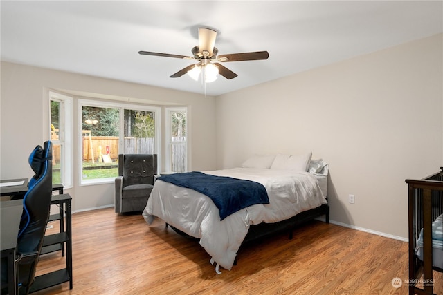 bedroom featuring ceiling fan and light hardwood / wood-style floors