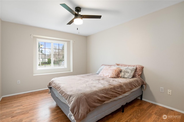 bedroom featuring ceiling fan and wood-type flooring