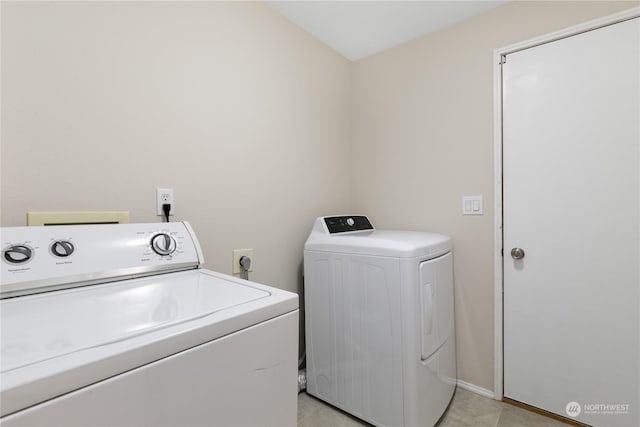 laundry room with separate washer and dryer