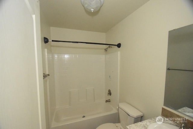 bathroom with toilet and tub / shower combination