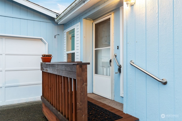 view of exterior entry featuring a garage