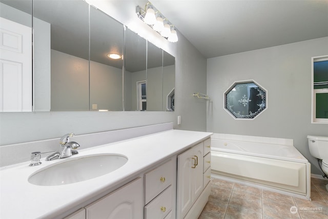 bathroom featuring vanity, toilet, and a bathtub