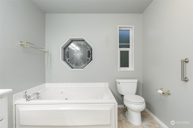 bathroom with a tub to relax in and toilet