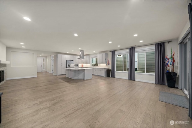 unfurnished living room with light hardwood / wood-style floors