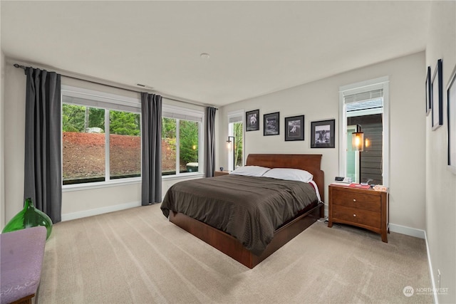 bedroom with light colored carpet