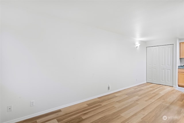 spare room with light wood-type flooring