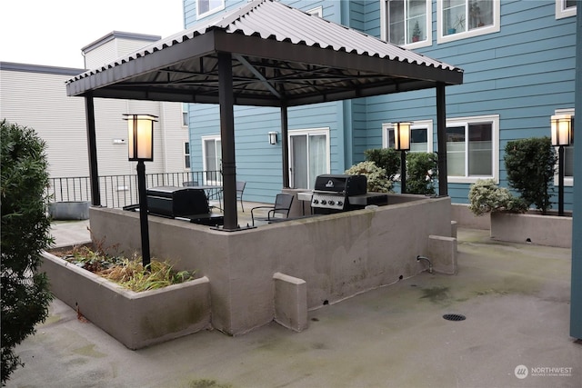 view of patio / terrace featuring a gazebo and area for grilling