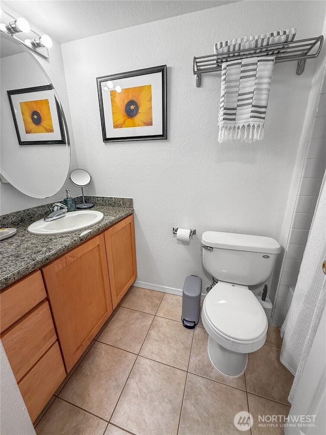 300 10th Ave Unit B-105, Seattle, WA 98122 - full bathroom with vanity, toilet, tile patterned flooring, baseboards, and curtained shower