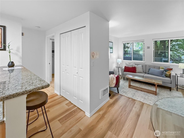 300 10th Ave Unit B-105, Seattle, WA 98122 - living room featuring light wood finished floors and baseboards