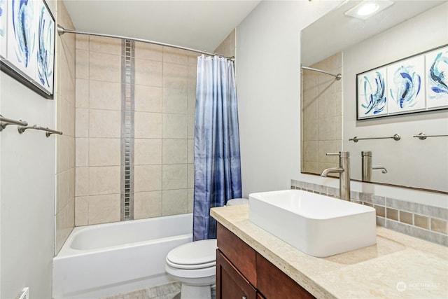 full bathroom featuring toilet, shower / tub combo, and vanity