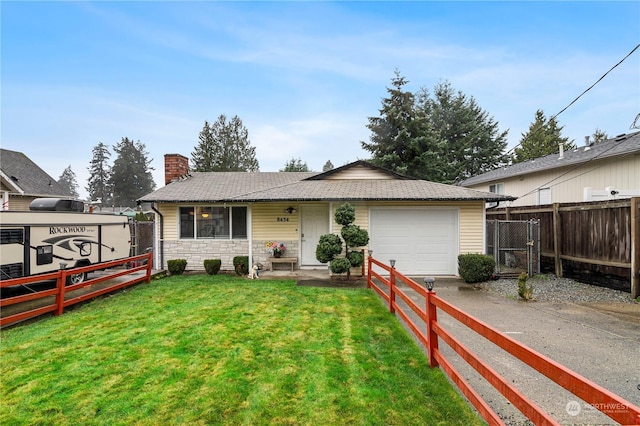 view of front of house featuring a garage and a front yard