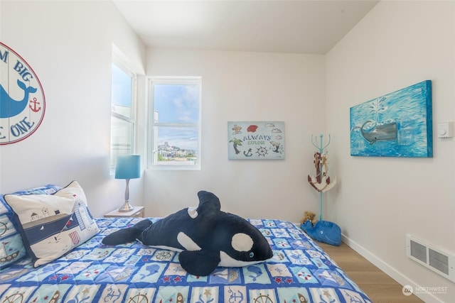 bedroom featuring wood-type flooring