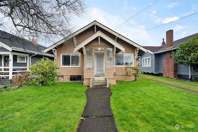 view of front of home with a front yard