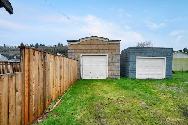 garage with a lawn