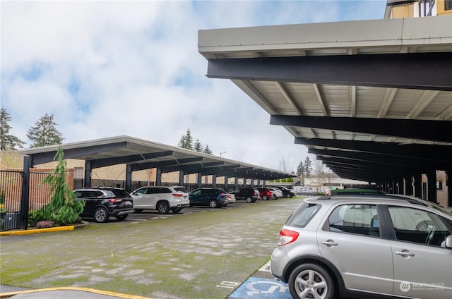 view of parking / parking lot featuring a carport