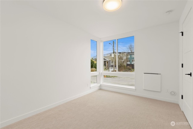 empty room featuring light colored carpet