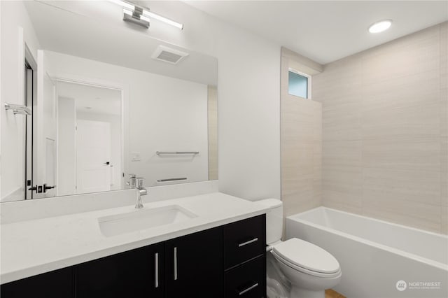 full bathroom featuring vanity, toilet, and bathtub / shower combination