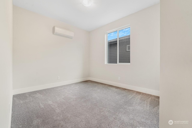 carpeted empty room featuring an AC wall unit