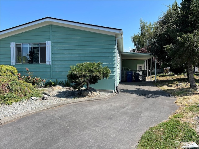 view of home's exterior with a carport