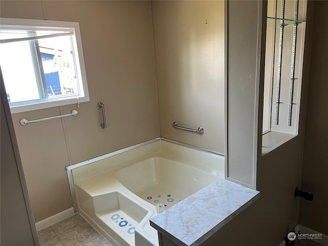 bathroom featuring tile patterned flooring and a bathing tub