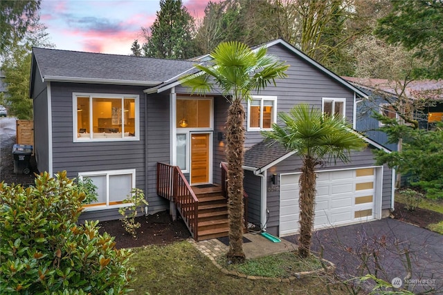 raised ranch featuring a garage