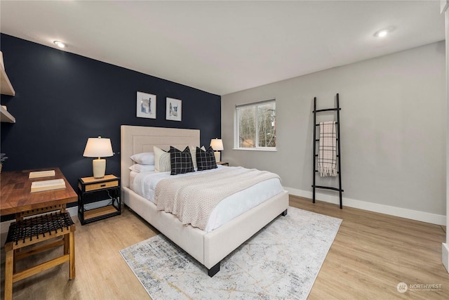 bedroom with light hardwood / wood-style flooring