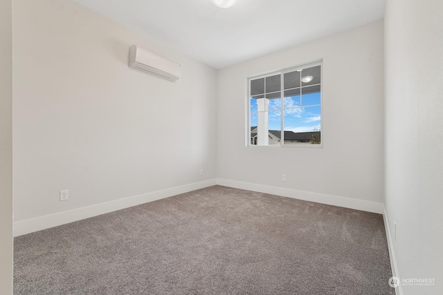 carpeted spare room featuring a wall mounted air conditioner