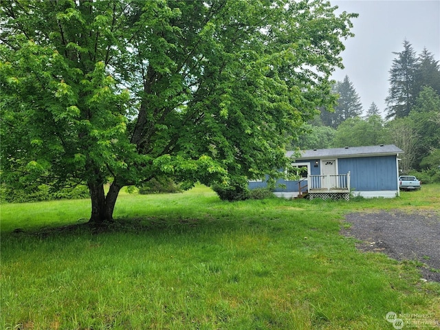 view of yard featuring a deck