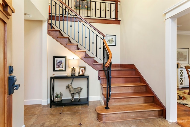 staircase with ornamental molding