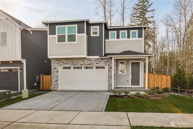 view of front of house featuring a garage and a front yard