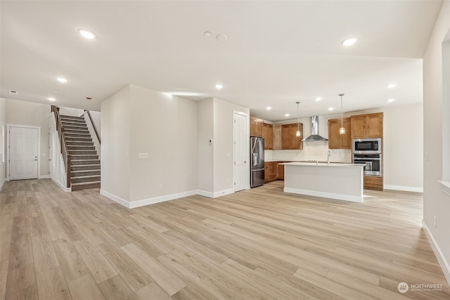 unfurnished living room with light hardwood / wood-style floors