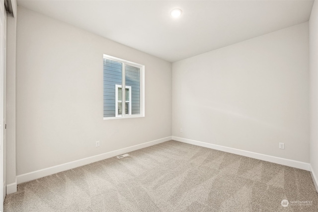 empty room with carpet flooring