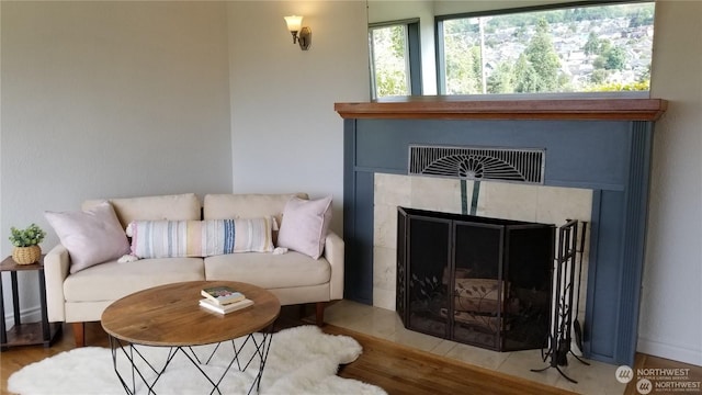 living room featuring hardwood / wood-style floors and a fireplace