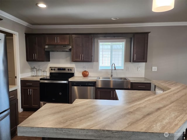 kitchen featuring dark brown cabinetry, sink, ornamental molding, dark hardwood / wood-style flooring, and stainless steel appliances