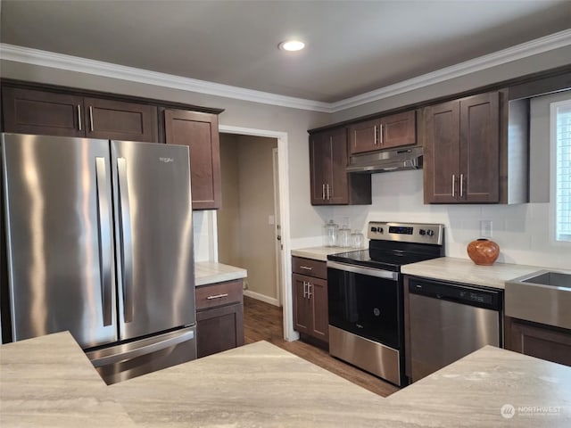 kitchen featuring hardwood / wood-style floors, crown molding, dark brown cabinetry, and stainless steel appliances