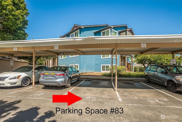 view of parking with a carport