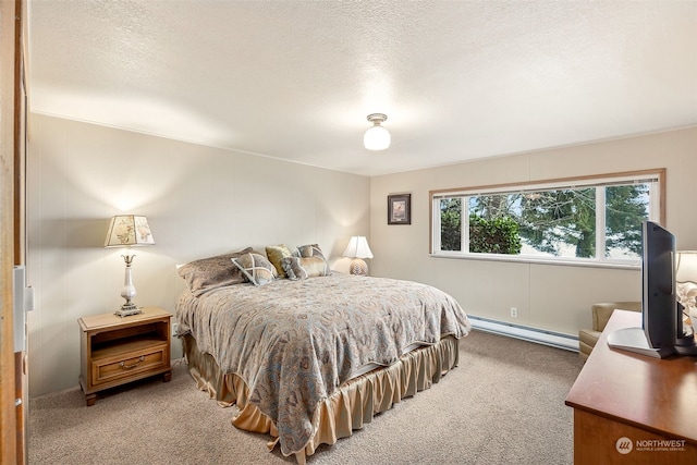 carpeted bedroom with baseboard heating and a textured ceiling