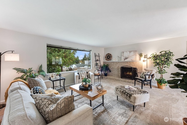 carpeted living room with a fireplace