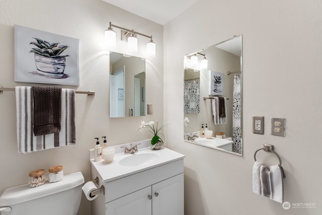 bathroom with vanity and toilet