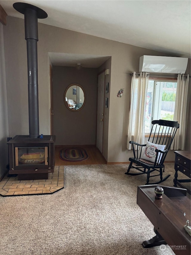 carpeted living room with an AC wall unit, a wood stove, and lofted ceiling