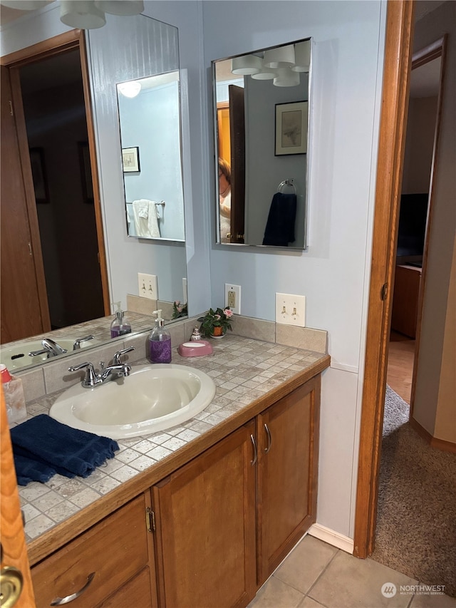 bathroom with vanity and tile patterned flooring