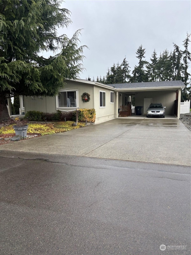 single story home featuring a carport