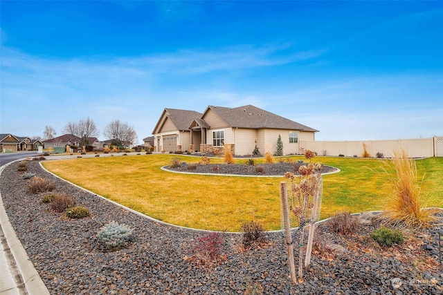 view of front of house featuring a garage and a front yard