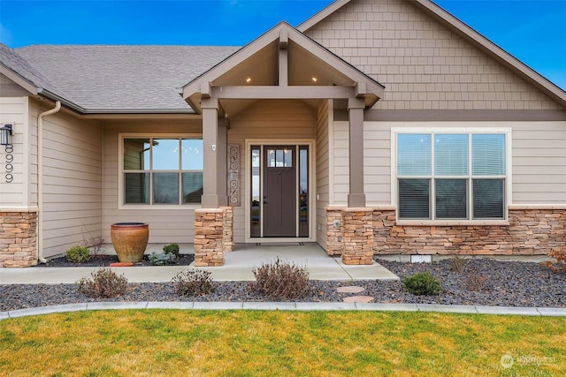 doorway to property featuring a yard