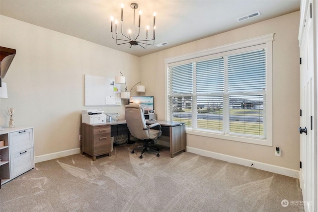 office with an inviting chandelier and light carpet