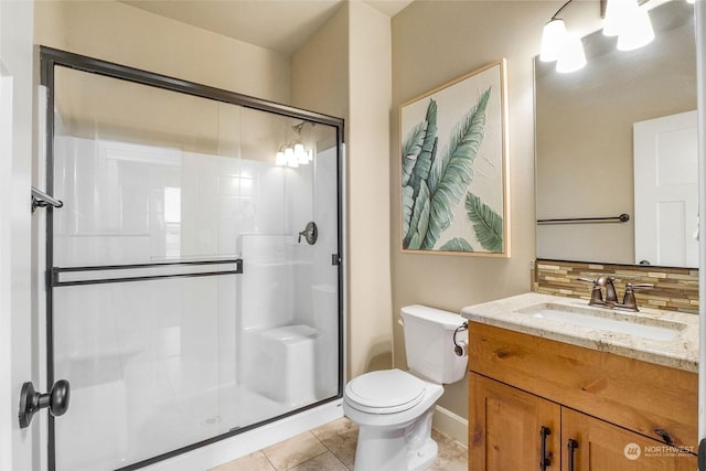 bathroom with toilet, walk in shower, backsplash, tile patterned floors, and vanity