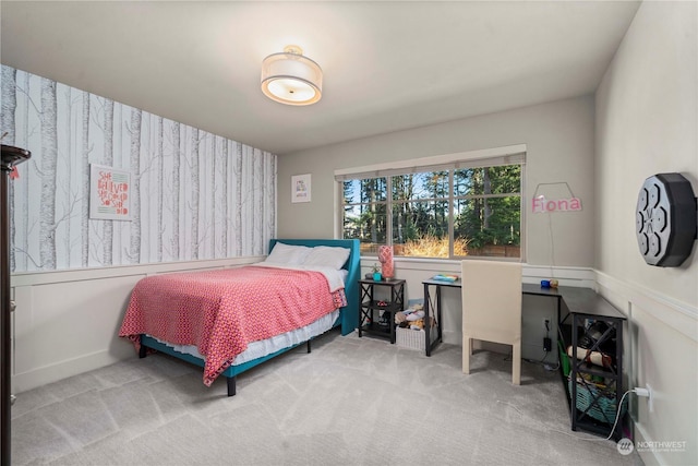 bedroom featuring light colored carpet