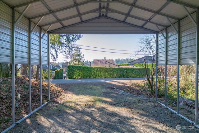 view of vehicle parking with a carport