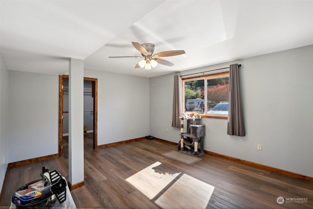 unfurnished room with ceiling fan and dark hardwood / wood-style floors