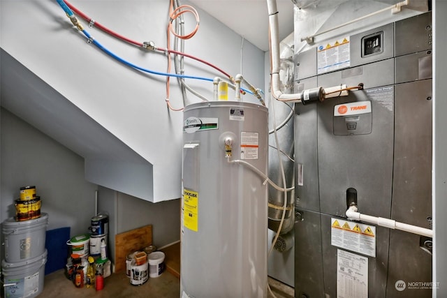 utility room featuring electric water heater and heating unit